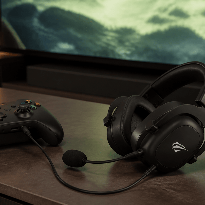 HAVIT H2002D wired gaming headset connected to an Xbox controller in a living-room setup